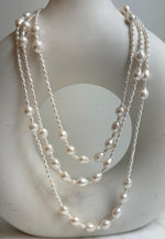 Elly’s 2.5-7.5mm Freshwater white iridescent Keshi pearls Long necklace:Extreme luster mirrored.