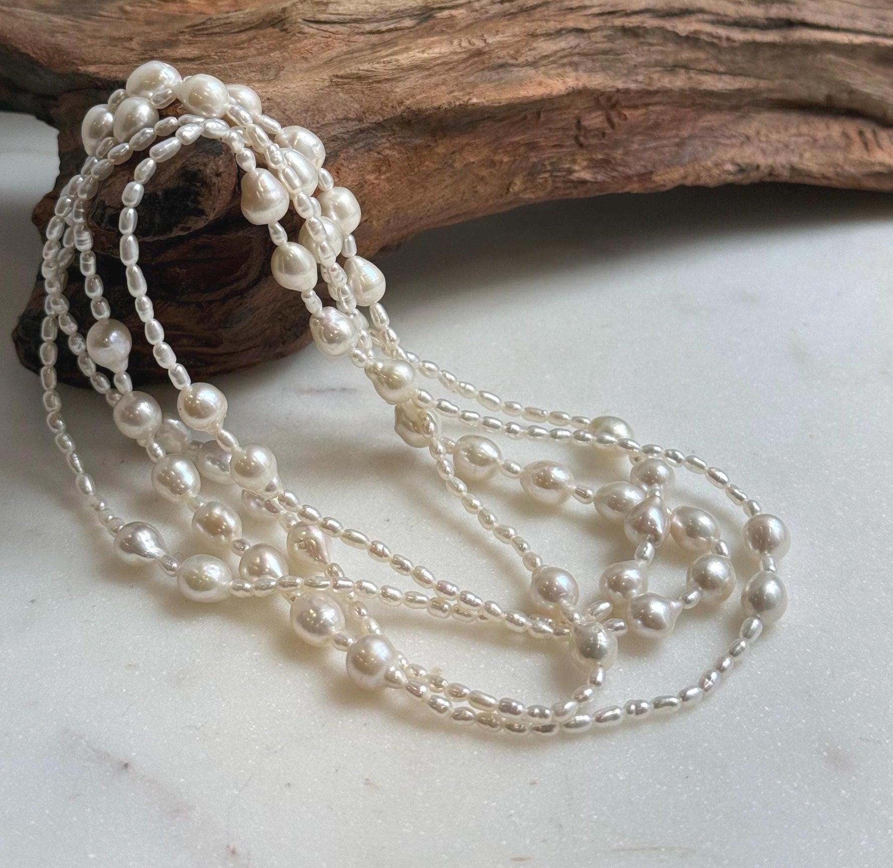 Elly’s 2.5-7.5mm Freshwater white iridescent Keshi pearls Long necklace:Extreme luster mirrored.