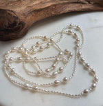 Elly’s 2.5-7.5mm Freshwater white iridescent Keshi pearls Long necklace:Extreme luster mirrored.