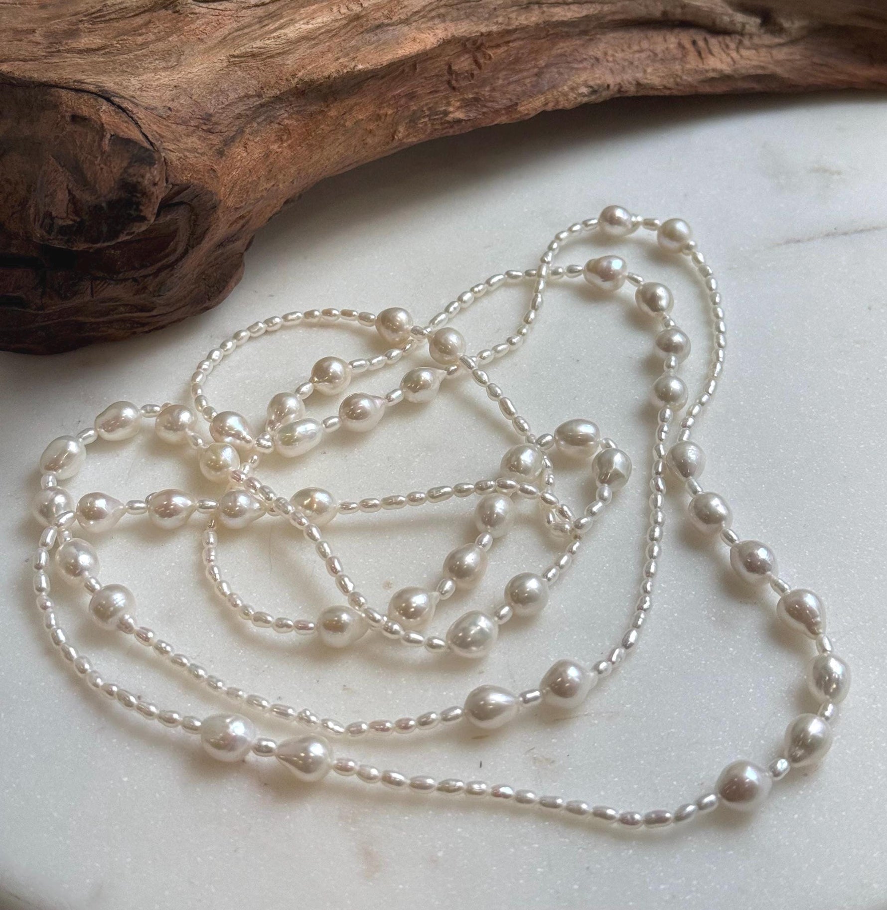 Elly’s 2.5-7.5mm Freshwater white iridescent Keshi pearls Long necklace:Extreme luster mirrored.