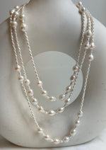 Elly’s 2.5-7.5mm Freshwater white iridescent Keshi pearls Long necklace:Extreme luster mirrored.