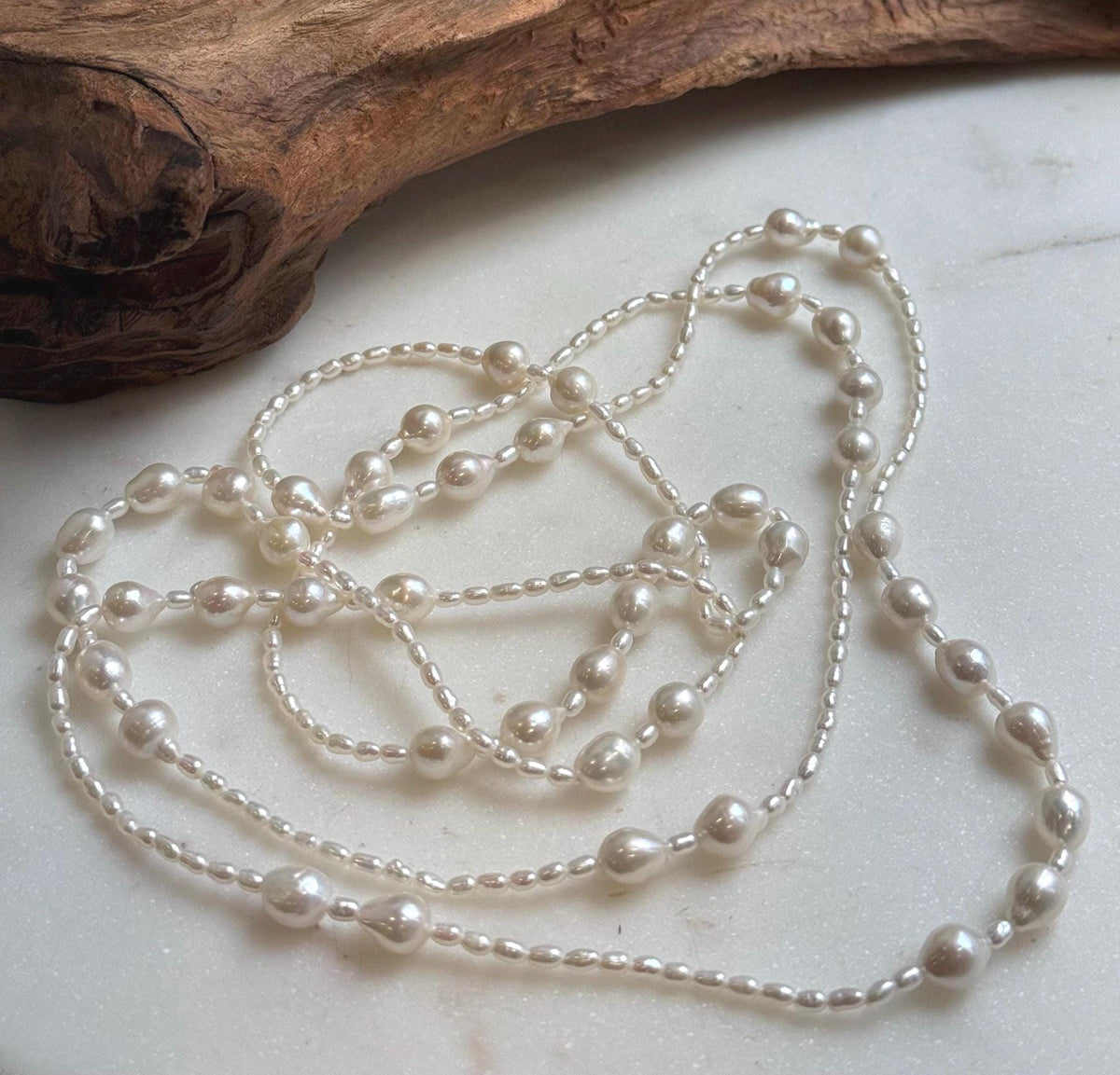 Elly’s 2.5-7.5mm Freshwater white iridescent Keshi pearls Long necklace:Extreme luster mirrored.
