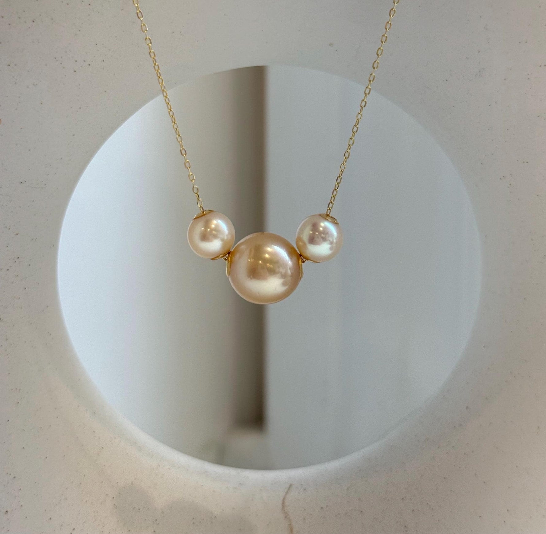 Elly’s Tri Au750 18k Gold South sea golden Akoya ocean Pearls Floating pendants:Extreme luster, 7.7-11.7mm.