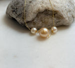 Elly’s Tri Au750 18k Gold South sea golden Akoya ocean Pearls Floating pendants:Extreme luster, 7.7-11.7mm.