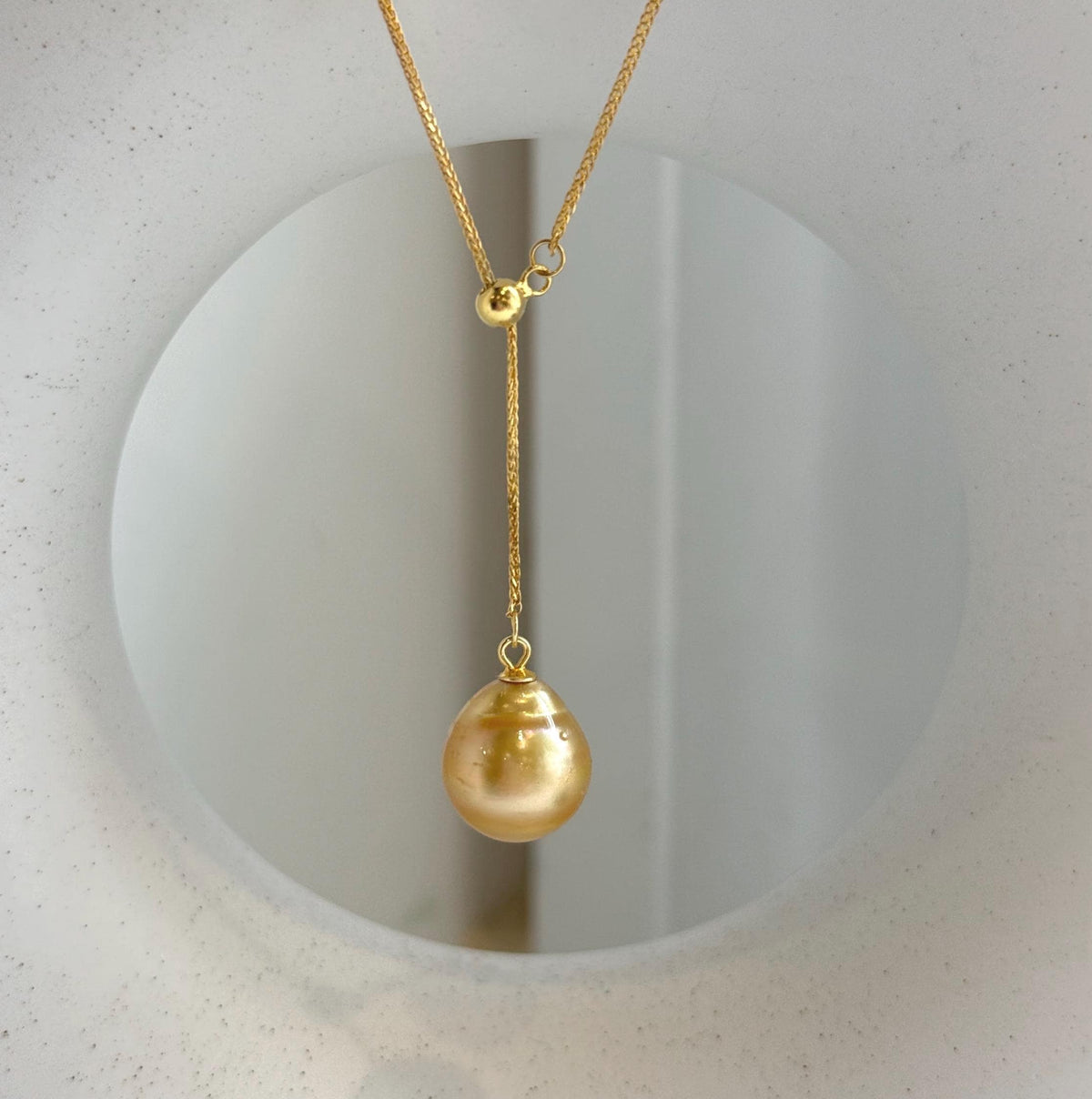 Elly’s 12.2mm Genius South sea deep tea golden ocean pearl Pendant: Extreme luster mirrored, to 17.3”, s925 silver Y-Lariat chain set.