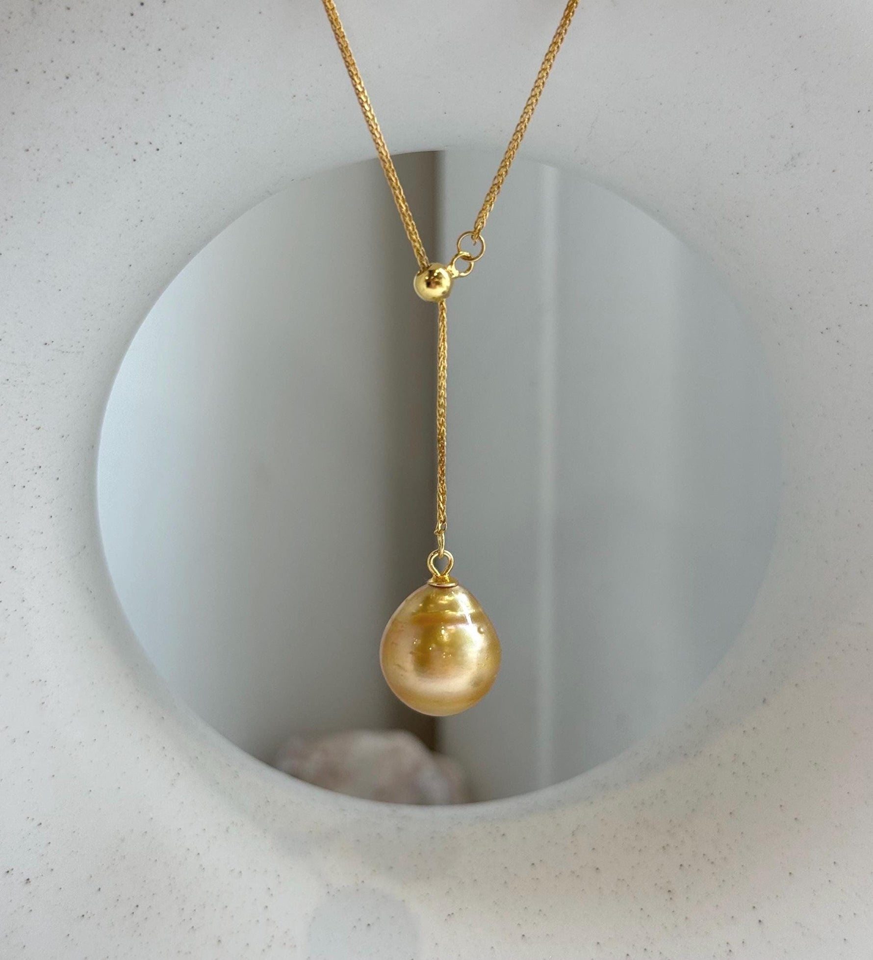 Elly’s 12.2mm Genius South sea deep tea golden ocean pearl Pendant: Extreme luster mirrored, to 17.3”, s925 silver Y-Lariat chain set.