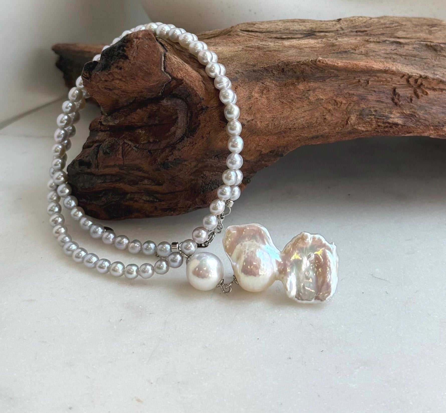 Elly’s Freshwater Large Petal baroque white pearl necklace:Extreme luster mirrored, 19.3x31mm, to 17.9”, S925 silver necklace strand.