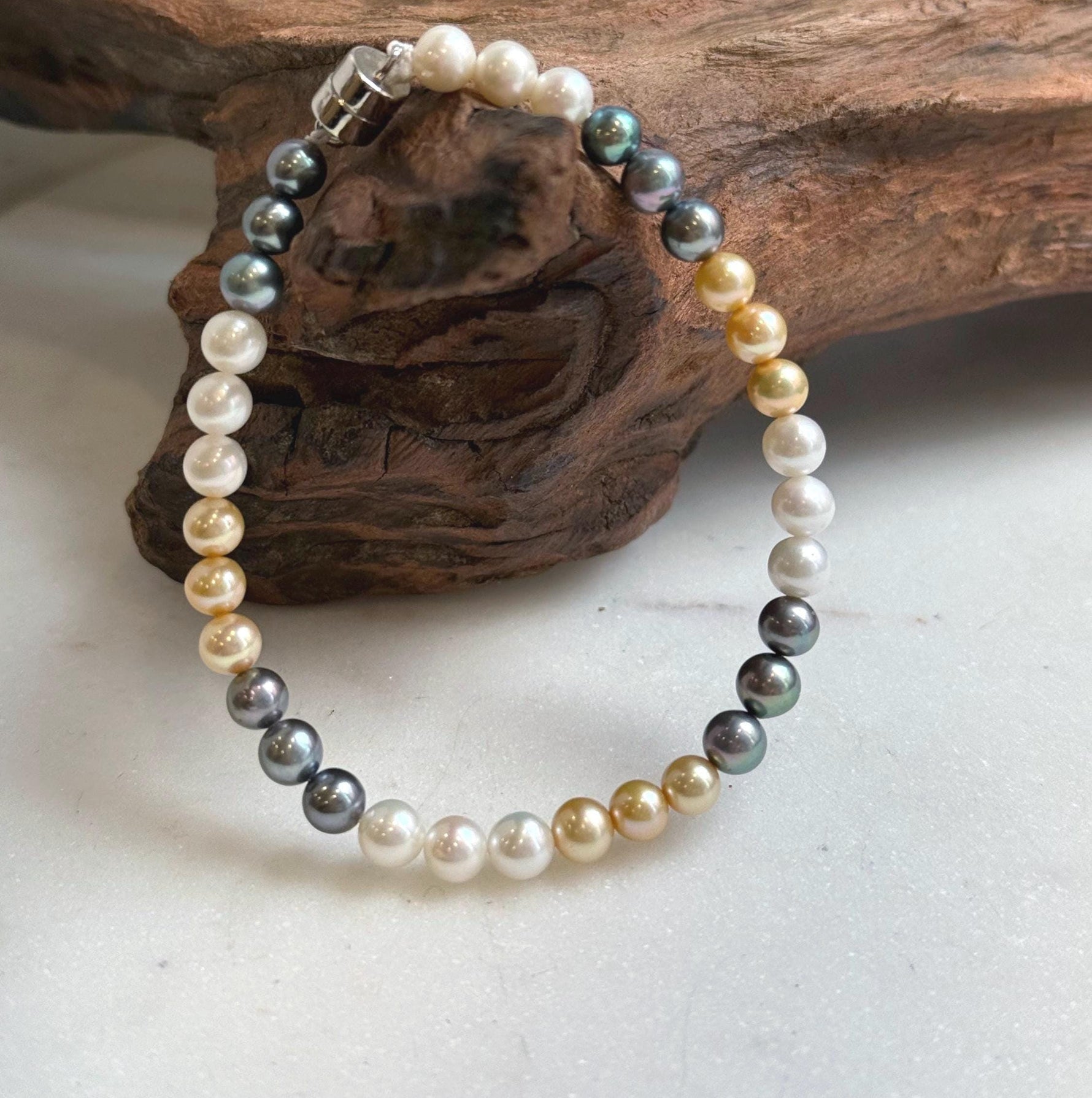 Elly’s 5.2-5.5mm  Freshwater White golden peacock pearls bracelet: Extreme luster mirrored, s925 silver bracelet, different sizes.