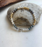 Elly’s 5.2-5.5mm  Freshwater White golden peacock pearls bracelet: Extreme luster mirrored, s925 silver bracelet, different sizes.