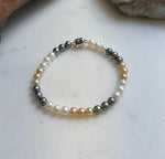 Elly’s 5.2-5.5mm  Freshwater White golden peacock pearls bracelet: Extreme luster mirrored, s925 silver bracelet, different sizes.