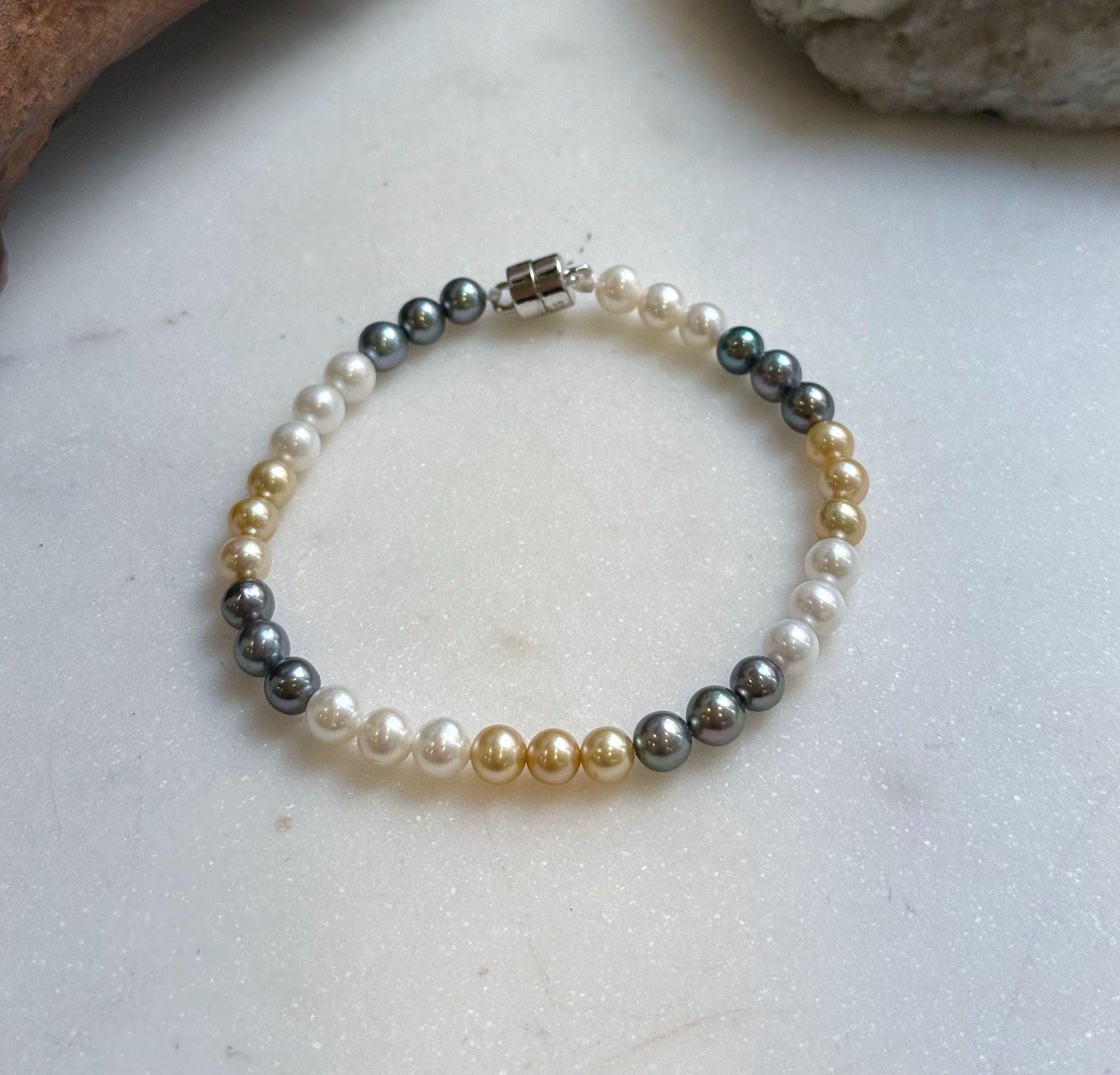Elly’s 5.2-5.5mm  Freshwater White golden peacock pearls bracelet: Extreme luster mirrored, s925 silver bracelet, different sizes.