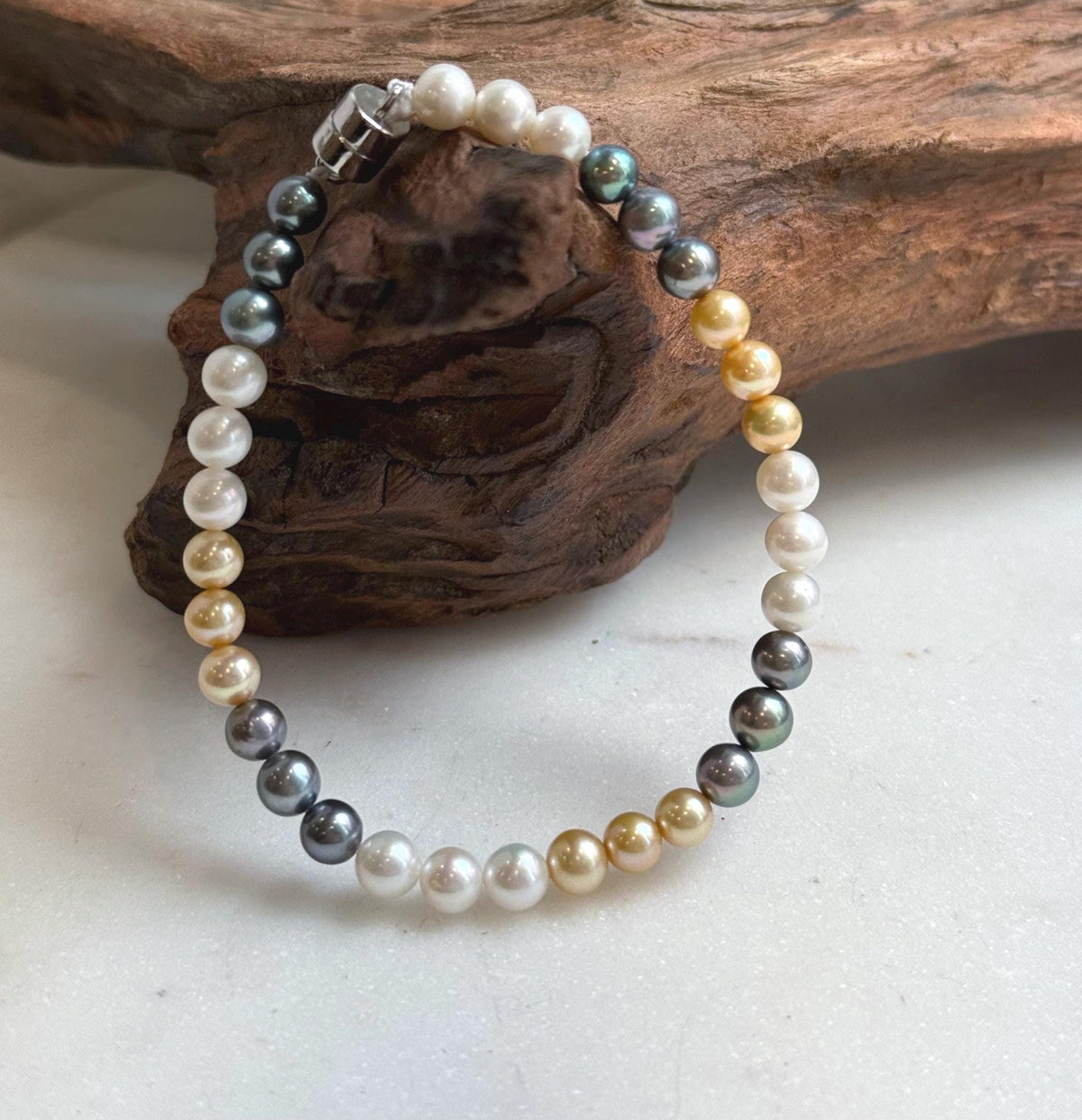 Elly’s 5.2-5.5mm  Freshwater White golden peacock pearls bracelet: Extreme luster mirrored, s925 silver bracelet, different sizes.
