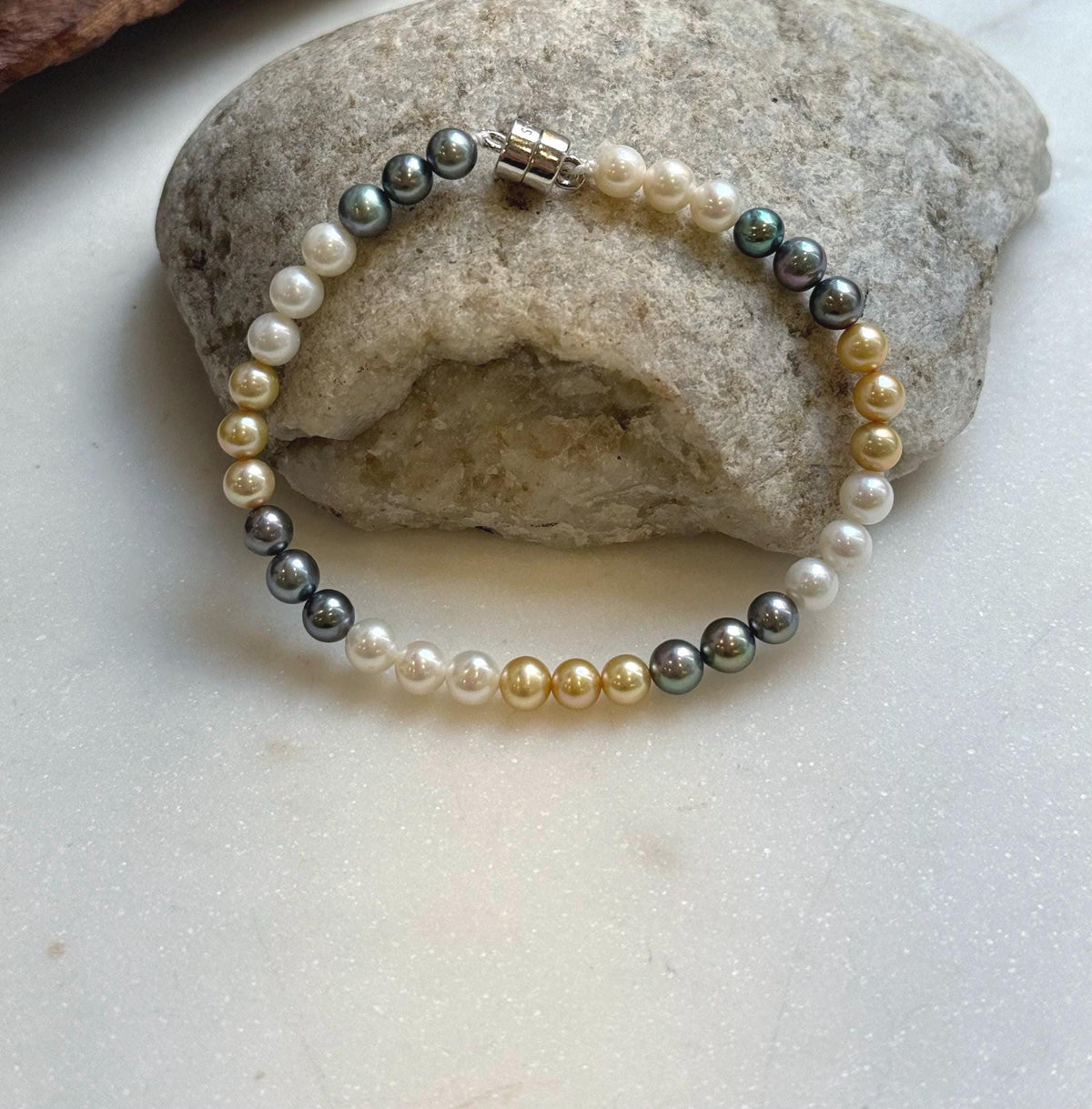 Elly’s 5.2-5.5mm  Freshwater White golden peacock pearls bracelet: Extreme luster mirrored, s925 silver bracelet, different sizes.
