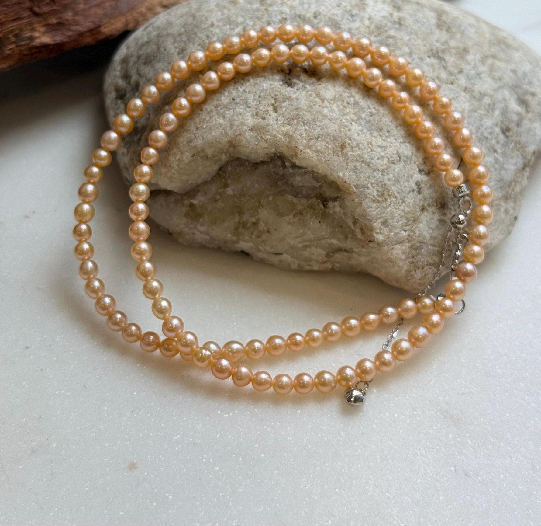 Elly’s 3.6-4mm Freshwater Peach gold Pearls Necklace: Extreme luster mirrored, To 18.3”, S925 silver necklace strand.