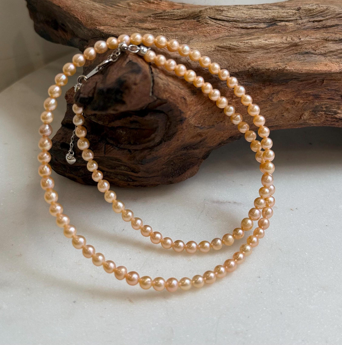 Elly’s 3.6-4mm Freshwater Peach gold Pearls Necklace: Extreme luster mirrored, To 18.3”, S925 silver necklace strand.