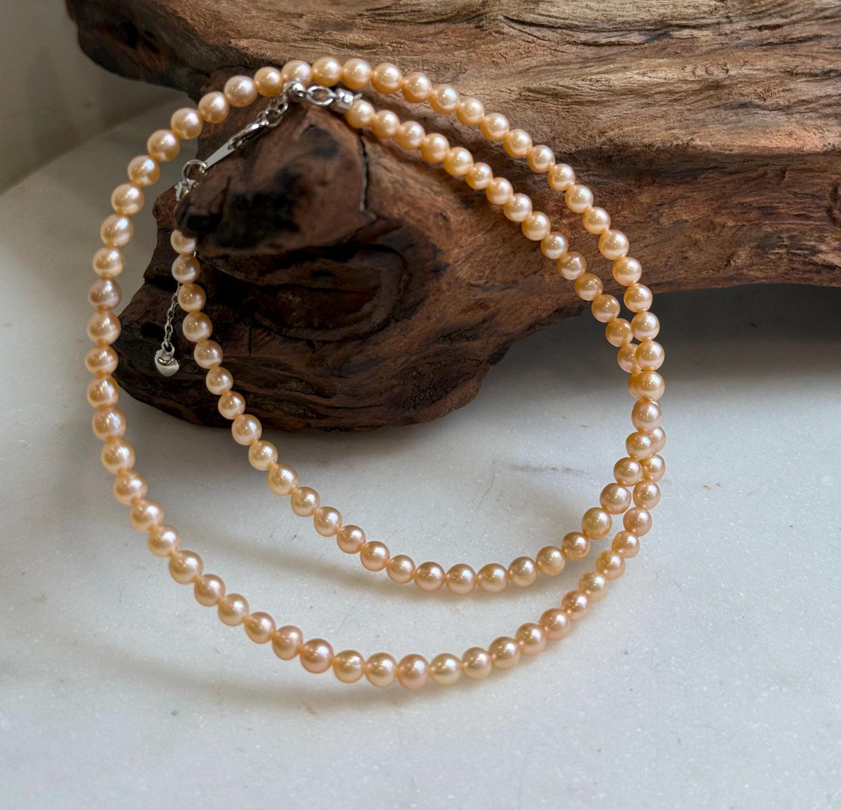 Elly’s 3.6-4mm Freshwater Peach gold Pearls Necklace: Extreme luster mirrored, To 18.3”, S925 silver necklace strand.