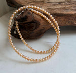Elly’s 3.6-4mm Freshwater Peach gold Pearls Necklace: Extreme luster mirrored, To 18.3”, S925 silver necklace strand.