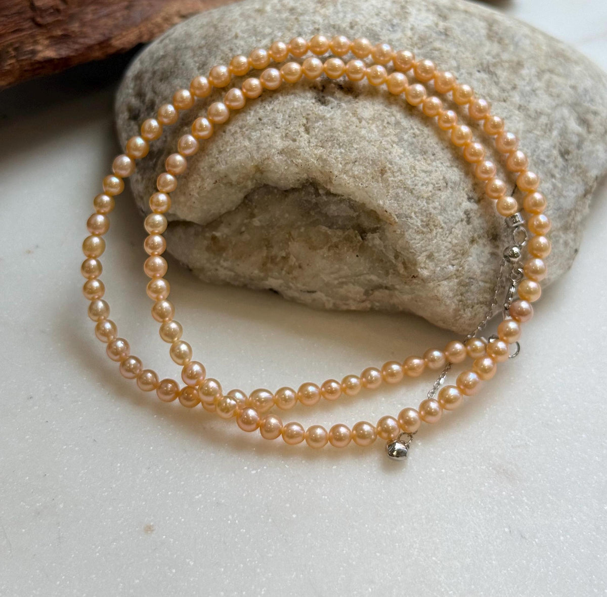 Elly’s 3.6-4mm Freshwater Peach gold Pearls Necklace: Extreme luster mirrored, To 18.3”, S925 silver necklace strand.