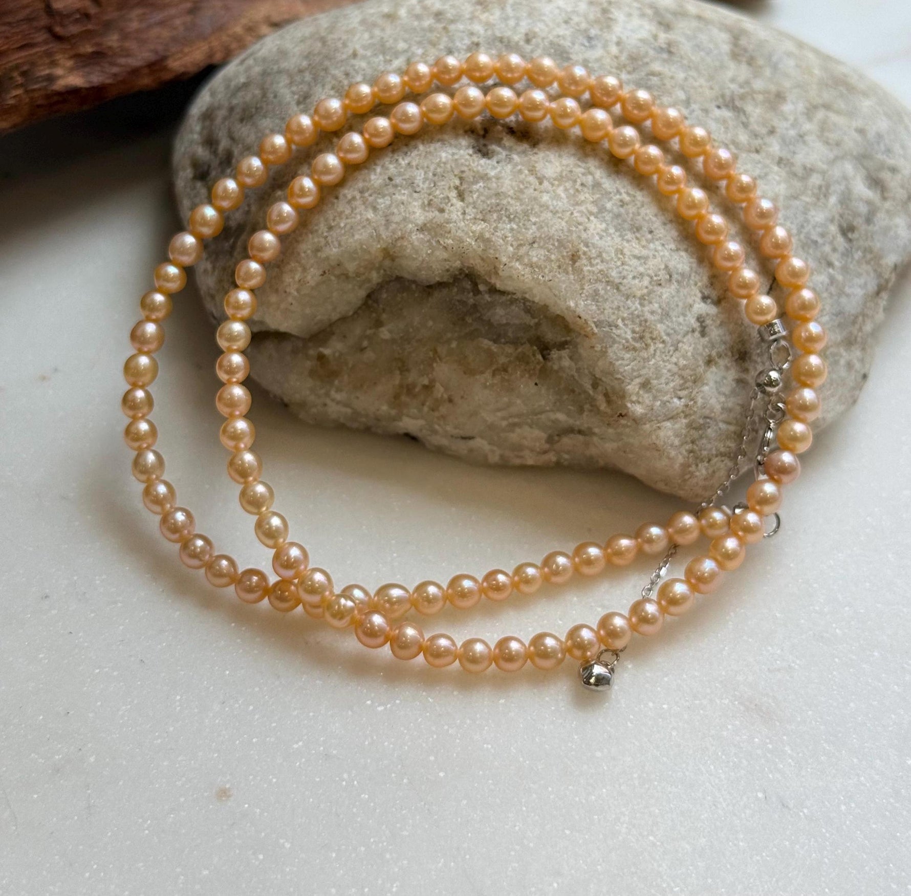 Elly’s 3.6-4mm Freshwater Peach gold Pearls Necklace: Extreme luster mirrored, To 18.3”, S925 silver necklace strand.