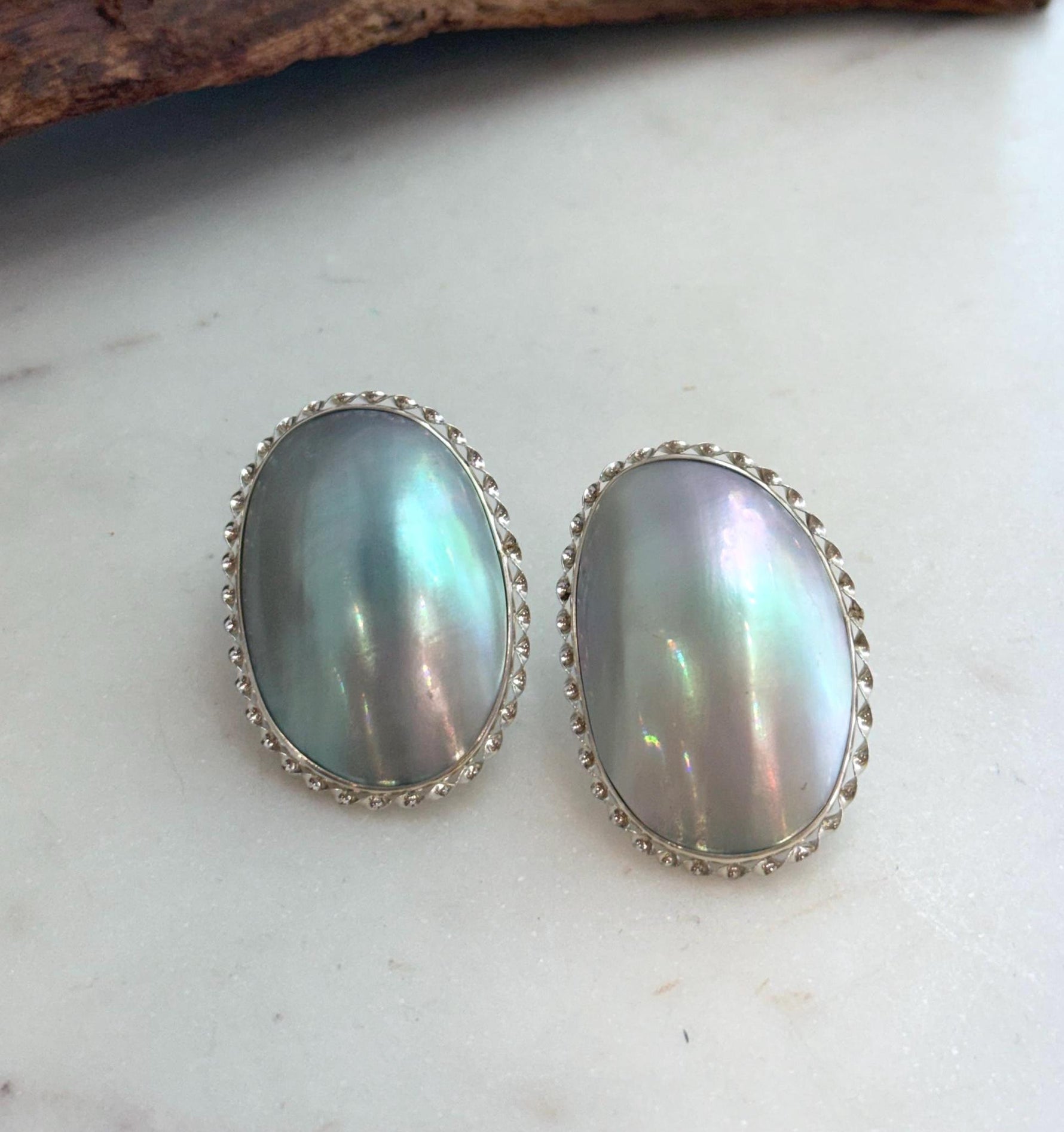 Elly’s Blue iridescent Ocean Mabe Huge Earrings: Extreme luster, 2.7x4cm, S925 silver earrings. 1 breath hole back.