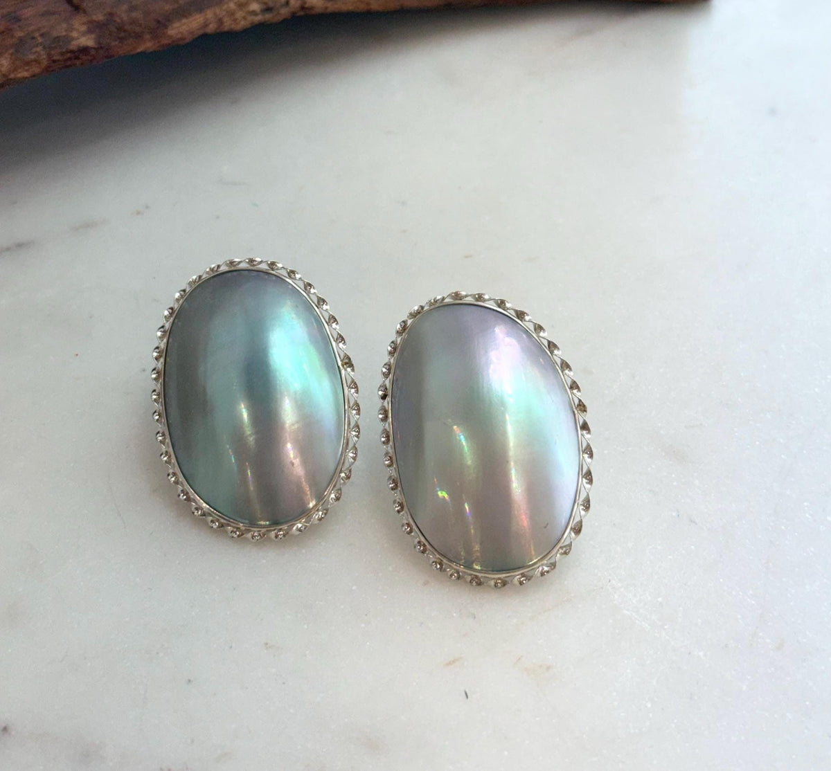 Elly’s Blue iridescent Ocean Mabe Huge Earrings: Extreme luster, 2.7x4cm, S925 silver earrings. 1 breath hole back.