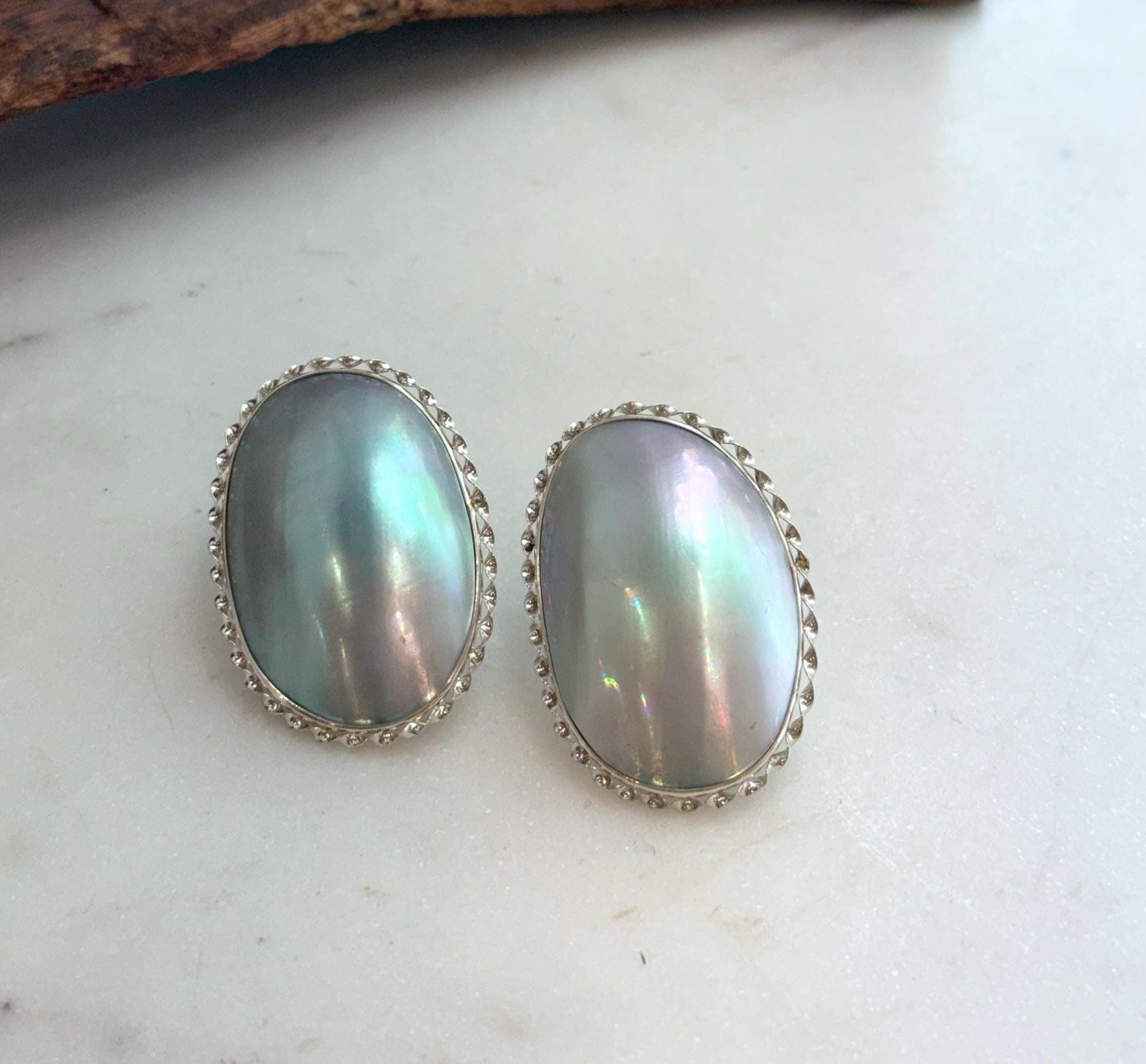 Elly’s Blue iridescent Ocean Mabe Huge Earrings: Extreme luster, 2.7x4cm, S925 silver earrings. 1 breath hole back.