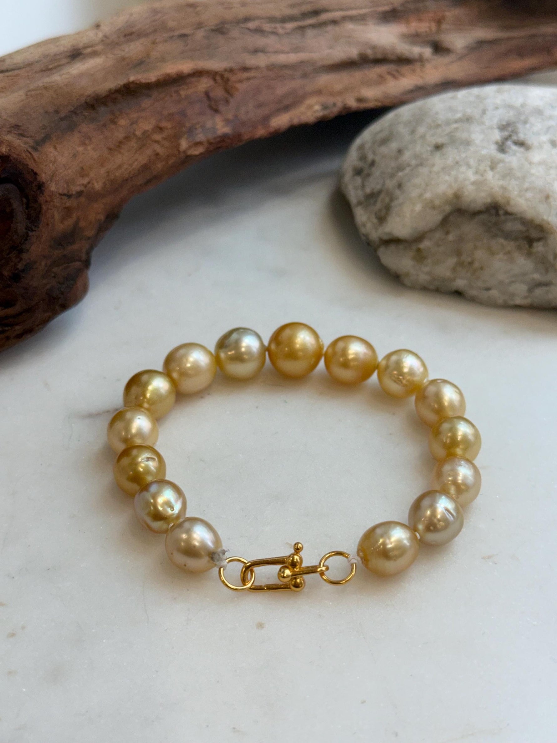 Elly’s 9.8-12.5mm 15pcs Genius South sea golden Ocean Pearls bracelet: Extreme luster, 8.1”, S925 silver bracelet.