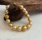 Elly’s 9.8-12.5mm 15pcs Genius South sea golden Ocean Pearls bracelet: Extreme luster, 8.1”, S925 silver bracelet.