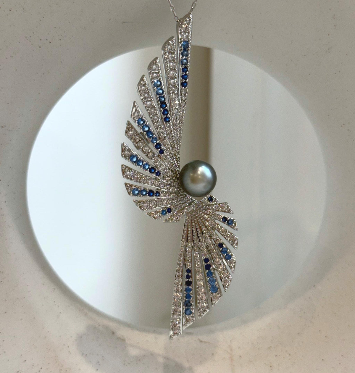 Elly’s 8.5mm Tahitian platinum blue Ocean feather Brooch Pendant 2in1: Extreme Luster mirrored, no chain.