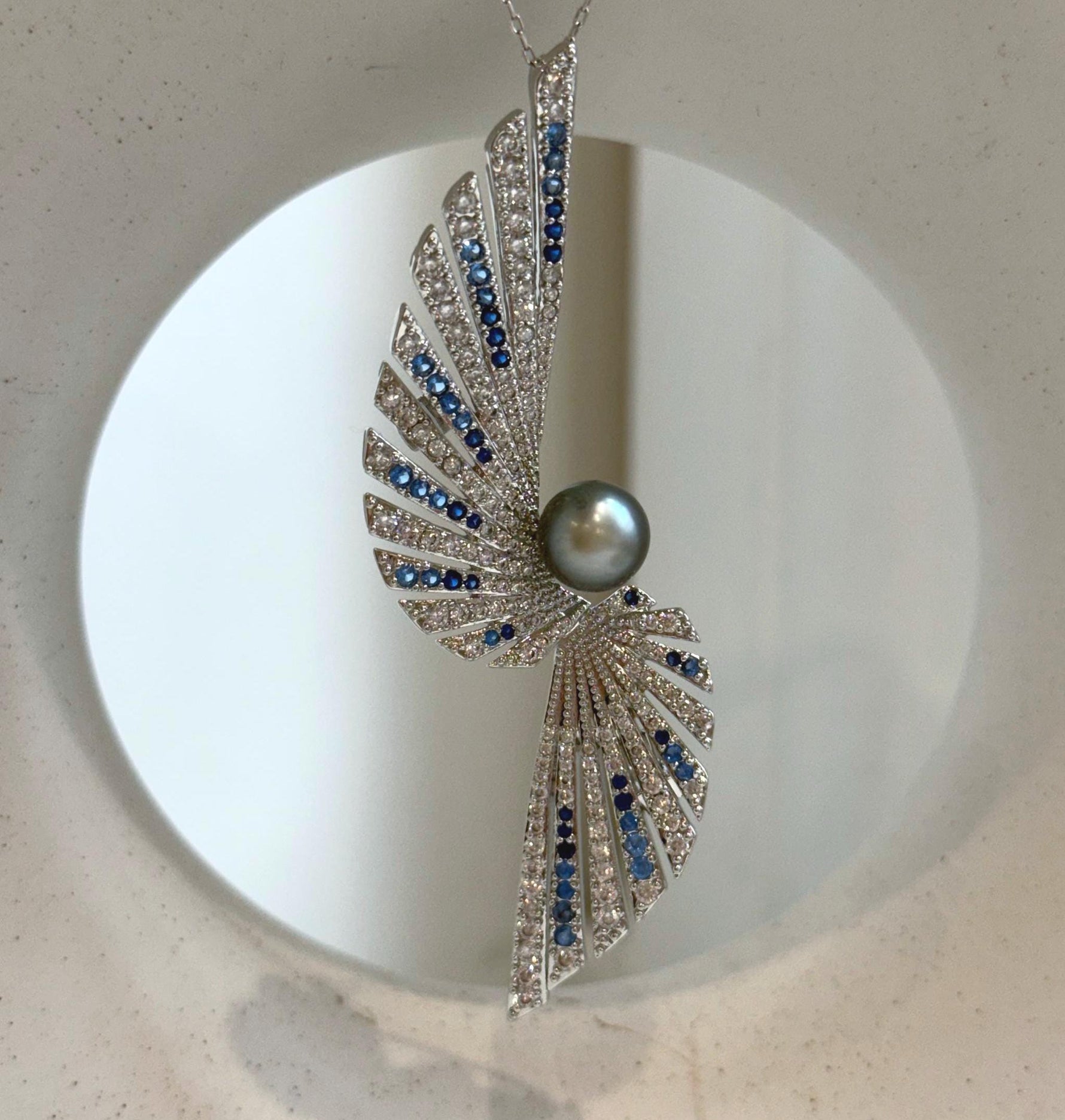 Elly’s 8.5mm Tahitian platinum blue Ocean feather Brooch Pendant 2in1: Extreme Luster mirrored, no chain.