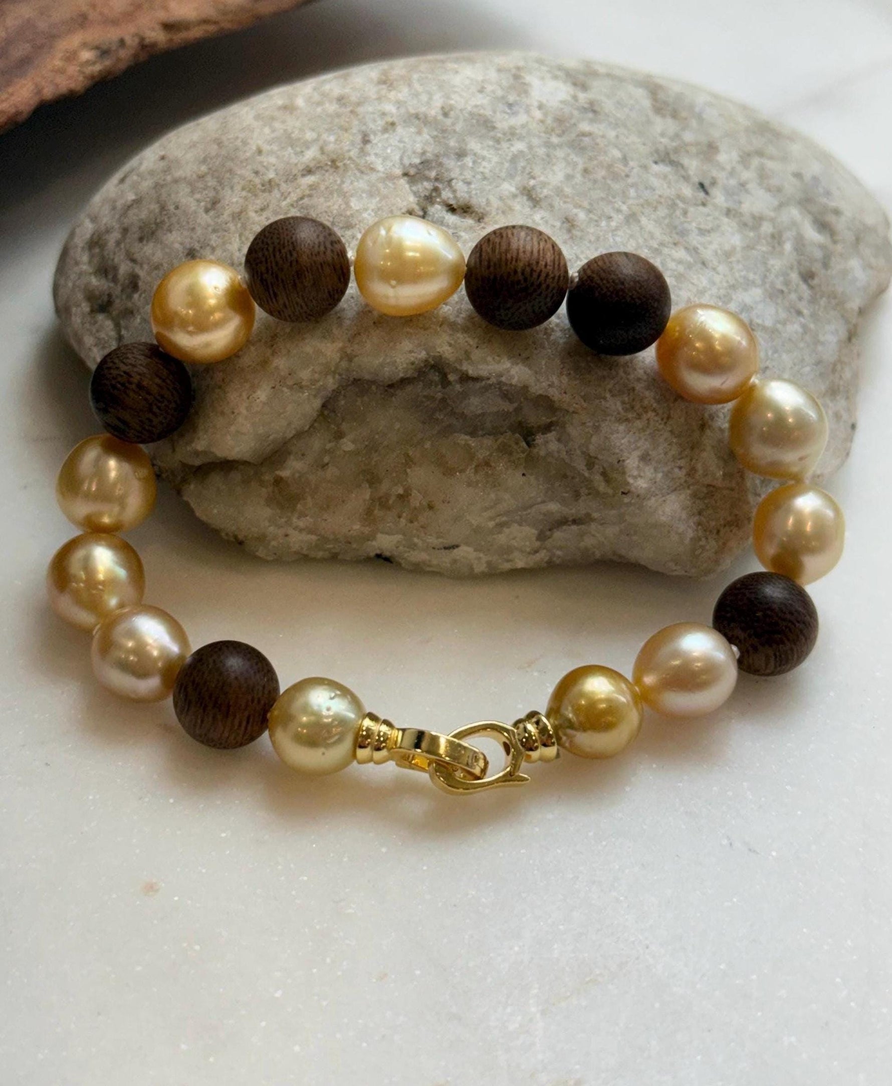 Elly’s 11pcs Genius South Sea Golden ocean Pearls Agarwood bracelet: Extreme luster, 8.9-10.5mm, 8.2” knotted.