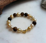 Elly’s 11pcs Genius South Sea Golden ocean Pearls Agarwood bracelet: Extreme luster, 8.9-10.5mm, 8.2” knotted.