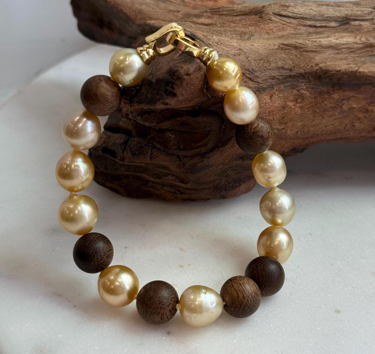 Elly’s 11pcs Genius South Sea Golden ocean Pearls Agarwood bracelet: Extreme luster, 8.9-10.5mm, 8.2” knotted.