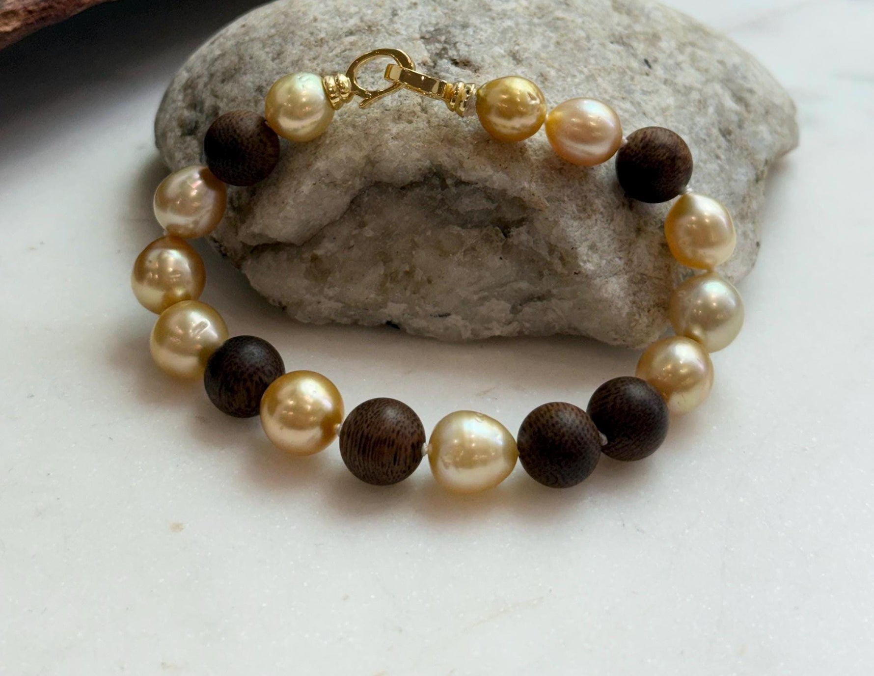 Elly’s 11pcs Genius South Sea Golden ocean Pearls Agarwood bracelet: Extreme luster, 8.9-10.5mm, 8.2” knotted.