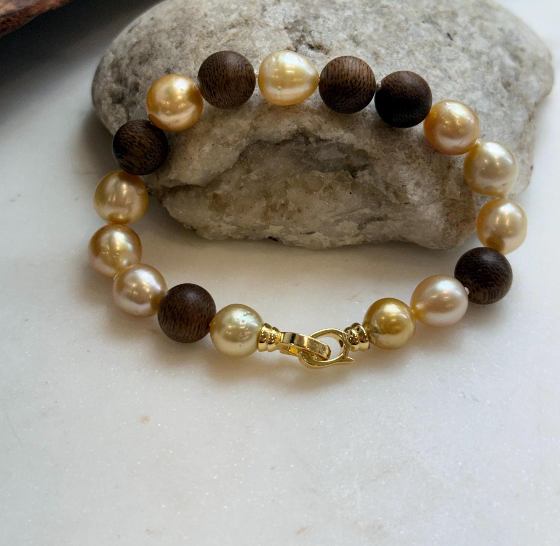 Elly’s 11pcs Genius South Sea Golden ocean Pearls Agarwood bracelet: Extreme luster, 8.9-10.5mm, 8.2” knotted.