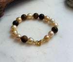 Elly’s 11pcs Genius South Sea Golden ocean Pearls Agarwood bracelet: Extreme luster, 8.9-10.5mm, 8.2” knotted.