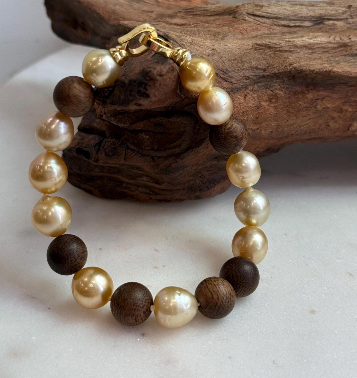 Elly’s 11pcs Genius South Sea Golden ocean Pearls Agarwood bracelet: Extreme luster, 8.9-10.5mm, 8.2” knotted.