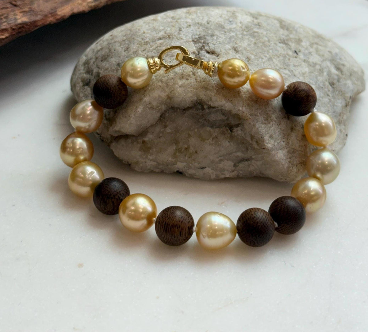 Elly’s 11pcs Genius South Sea Golden ocean Pearls Agarwood bracelet: Extreme luster, 8.9-10.5mm, 8.2” knotted.