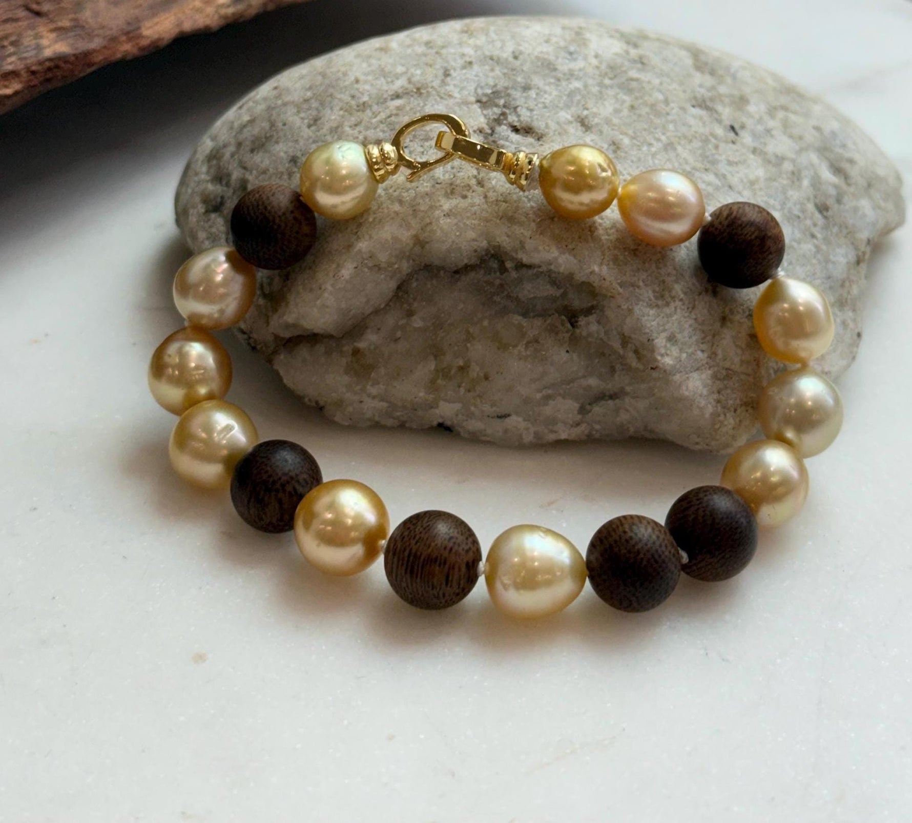 Elly’s 11pcs Genius South Sea Golden ocean Pearls Agarwood bracelet: Extreme luster, 8.9-10.5mm, 8.2” knotted.