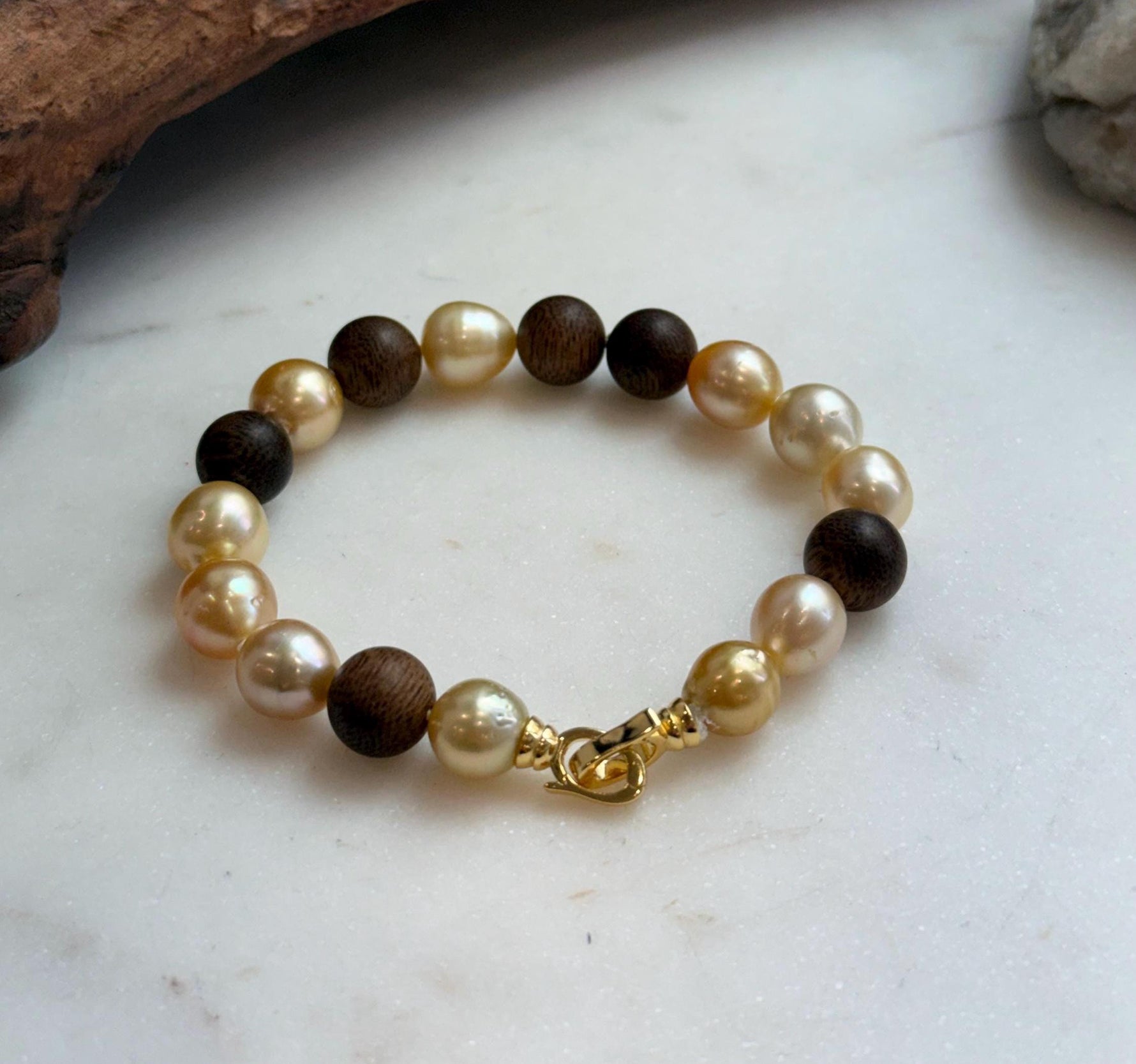 Elly’s 11pcs Genius South Sea Golden ocean Pearls Agarwood bracelet: Extreme luster, 8.9-10.5mm, 8.2” knotted.
