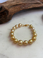 Elly’s 10.4-13.4mm 15pcs Genius South sea golden Ocean Pearls bracelet: Extreme luster, 8.5”, S925 silver bracelet.