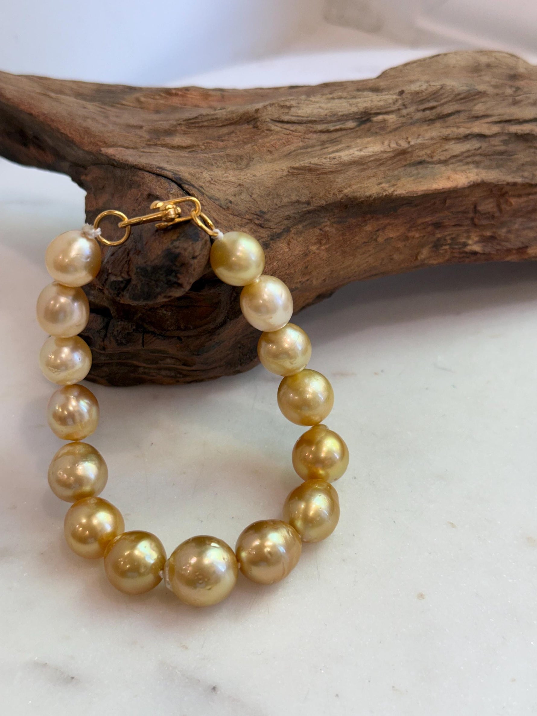 Elly’s 10.4-13.4mm 15pcs Genius South sea golden Ocean Pearls bracelet: Extreme luster, 8.5”, S925 silver bracelet.