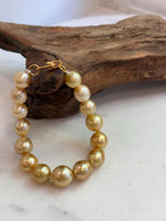 Elly’s 10.4-13.4mm 15pcs Genius South sea golden Ocean Pearls bracelet: Extreme luster, 8.5”, S925 silver bracelet.