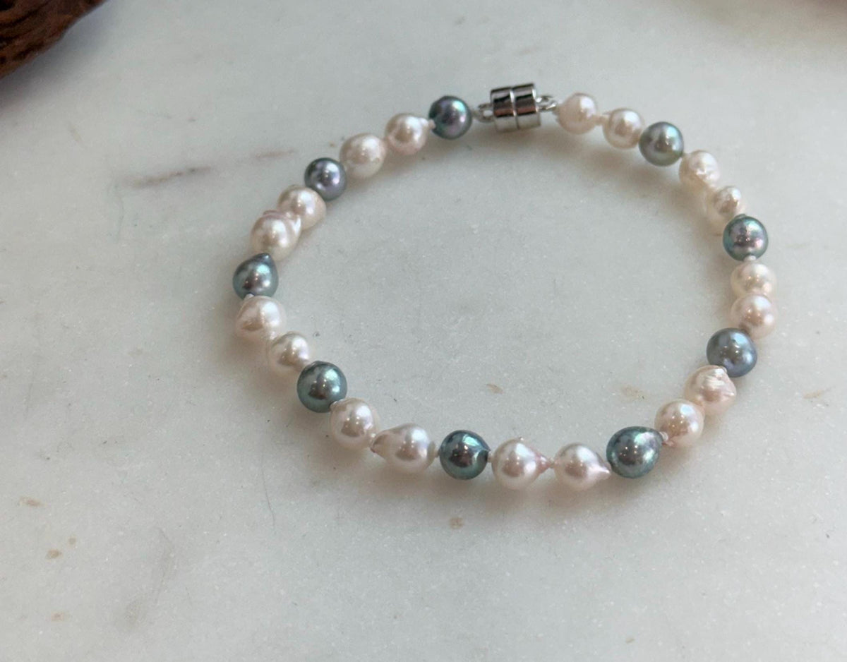 Elly’s 5.5-6mm Akoya Pink blue ocean pearls bracelet:Extreme luster mirrored, knotted, 7.4”, S925 silver bracelet.