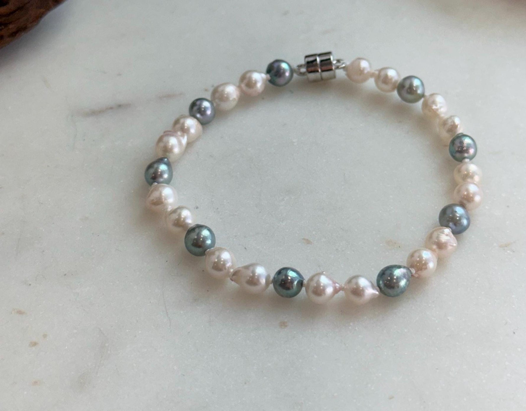 Elly’s 5.5-6mm Akoya Pink blue ocean pearls bracelet:Extreme luster mirrored, knotted, 7.4”, S925 silver bracelet.