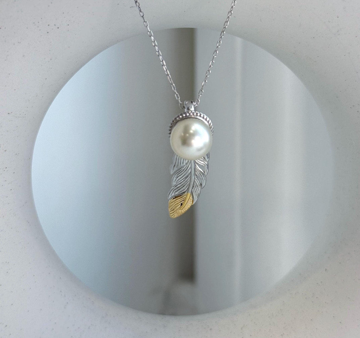 Elly’s 9.3mm Genius South sea ivory Ocean Pearl leather Pendant: Extreme luster mirrored, 1x3cm, S925 silver pendant.