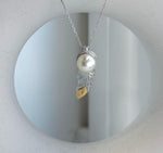 Elly’s 9.3mm Genius South sea ivory Ocean Pearl leather Pendant: Extreme luster mirrored, 1x3cm, S925 silver pendant.