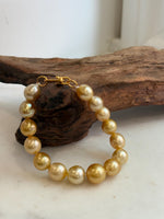 Elly’s 9.8-12.5mm 15pcs Genius South sea golden Ocean Pearls bracelet: Extreme luster, 8.1”, S925 silver bracelet.