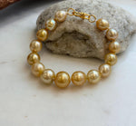 Elly’s 9.8-12.5mm 15pcs Genius South sea golden Ocean Pearls bracelet: Extreme luster, 8.1”, S925 silver bracelet.
