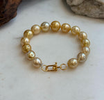 Elly’s 9.8-12.5mm 15pcs Genius South sea golden Ocean Pearls bracelet: Extreme luster, 8.1”, S925 silver bracelet.